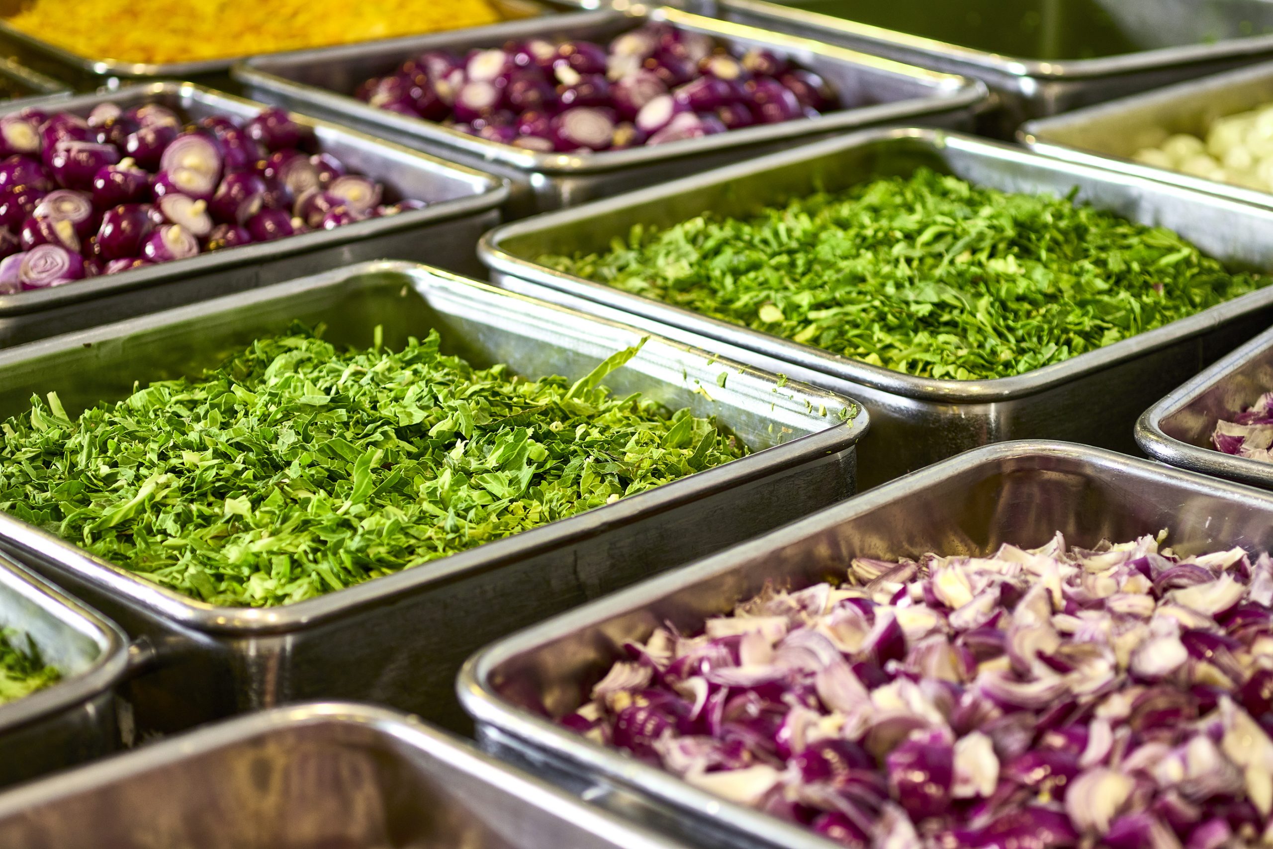 metal trays full of vegetables