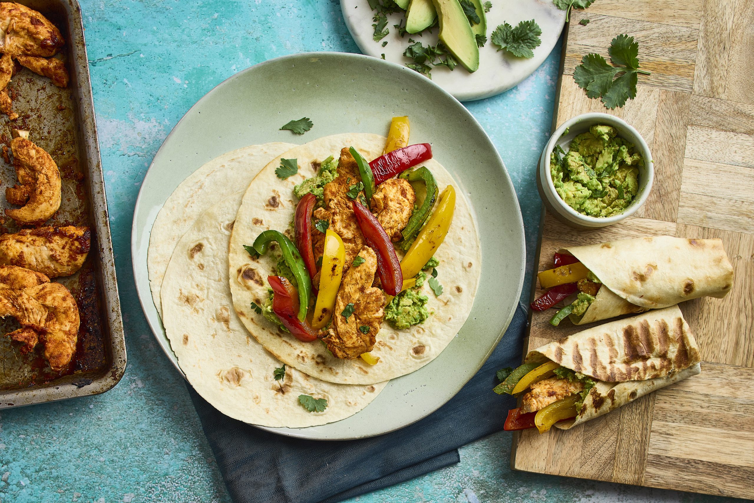 A vegetable wrap, with various other vegetable dishes on the table