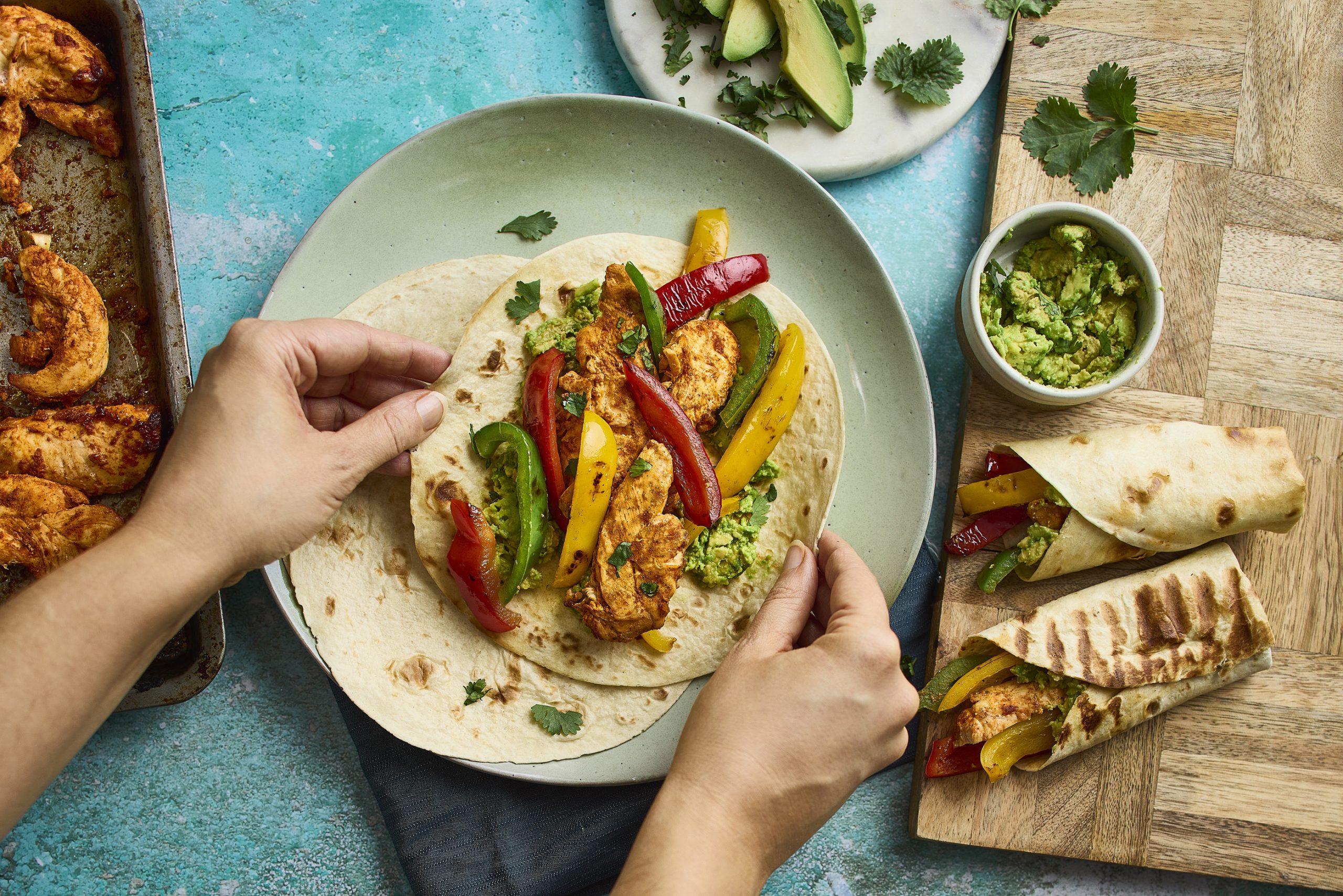 A vegetable wrap, with various other vegetable dishes on the table