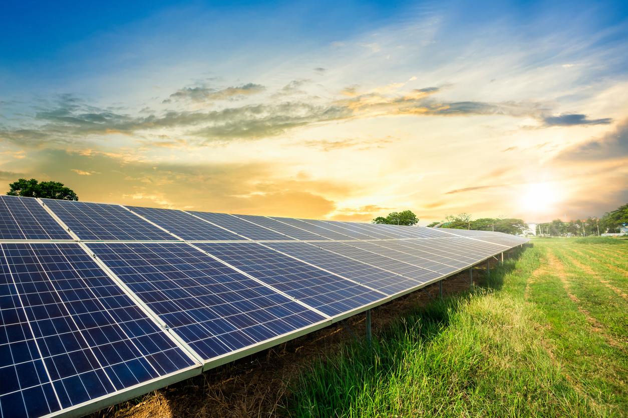 Solar panel cell on dramatic sunset sky background